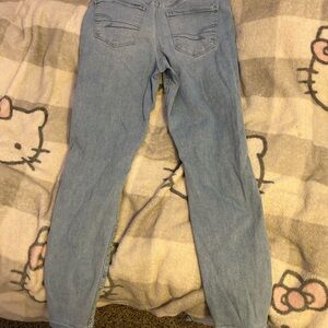 Light blue ripped American Eagle skinny jeans